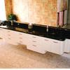 Custom wall hung vanity with radius end panels in white lacquer and black granite top in same house as bar