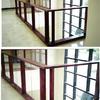 Custom built railing, 5/4 oak framing around 3/8 glass panels rabbeted within frames on second floor of an office building over looking the entryway
